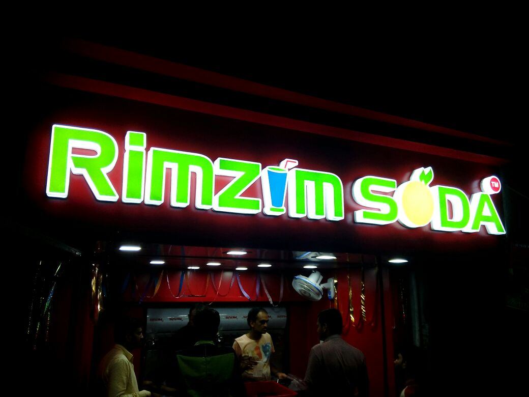 Rimzim Soda illuminated acrylic letter shop board at night